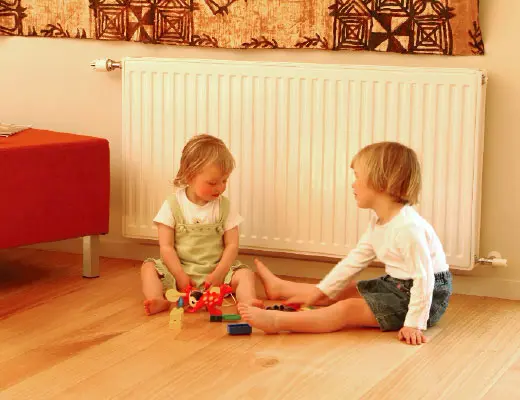 Children playing in front of radiator