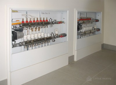 Twin underfloor manifold cabinets