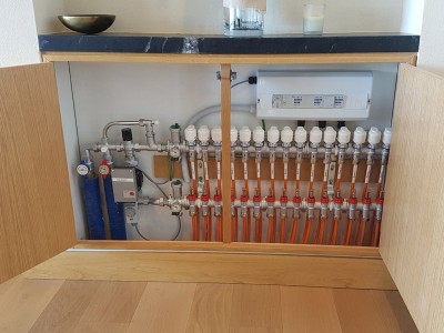 Manifold tucked away in a cupboard