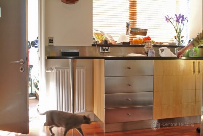 Radiator beneath kitchen bench