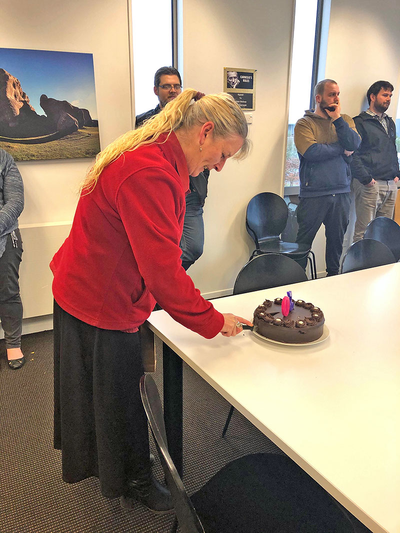 Julie cutting birthday cake